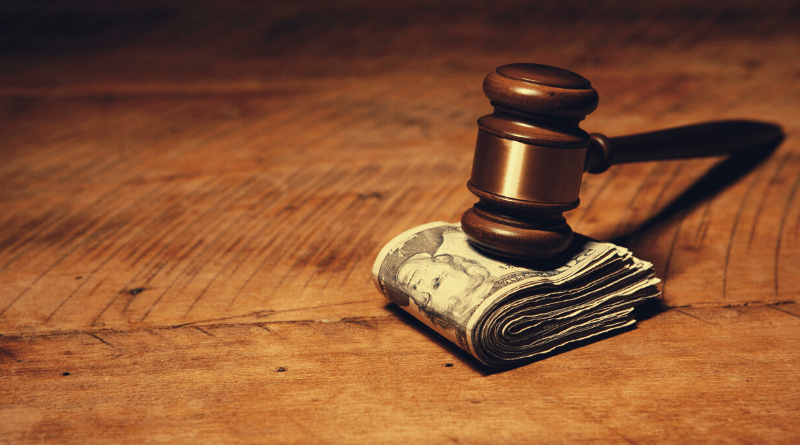 gavel on top of dollar bills